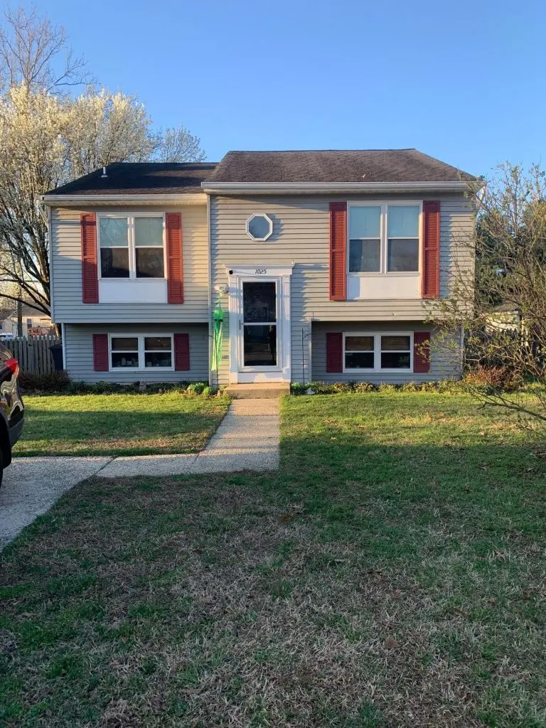 Before, Glen Burnie split-level with original beige siding