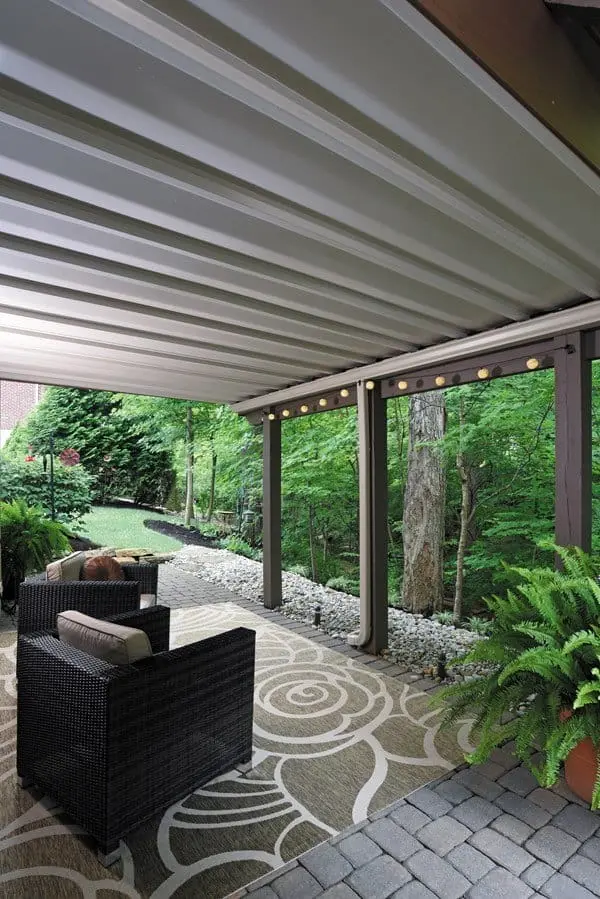 Dry living space beneath a deck kept dry by a water divergent system