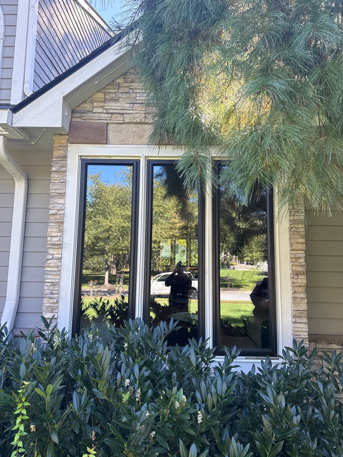 Completed black ProVia Endure windows on the front elevation of an Ellicott City home.