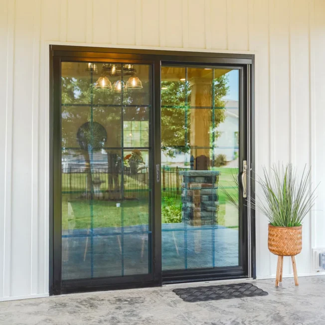 Endure patio door in coal black with colonial grids.