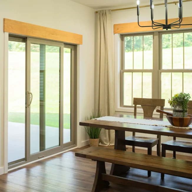 Endure 2-lite sliding patio door and double-hung windows in sandstone.