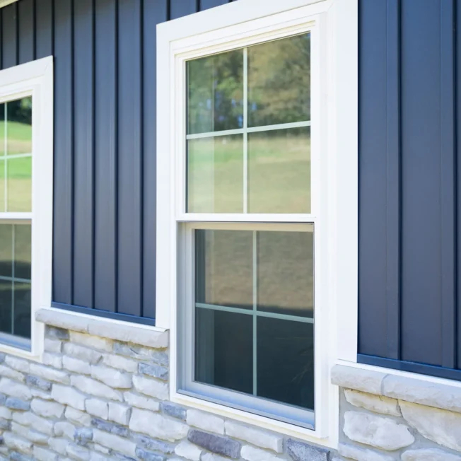 ProVia Endure double-hung vinyl windows in white with cottage grids.