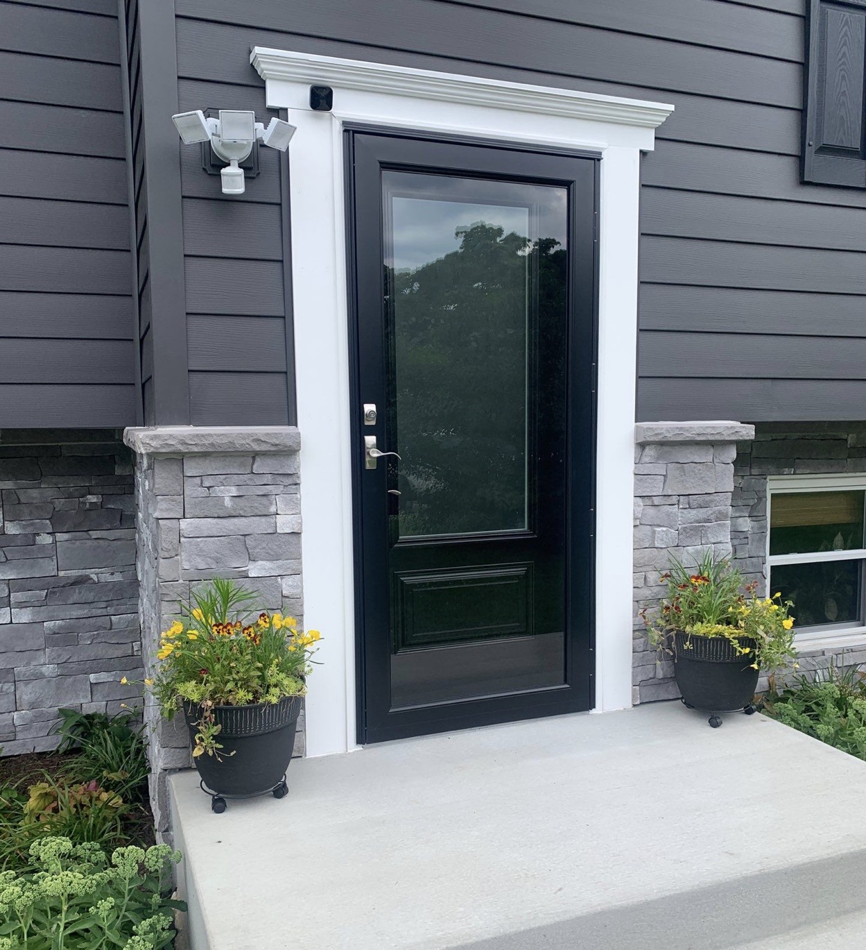 ProVia Heritage fiberglass entry door in Coal Black with a storm door, Glen Burnie, MD.