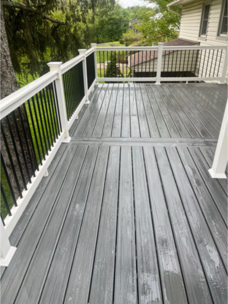 Trex Transcend Island Mist deck with white vinyl railing and black pickets in Ellicott City Maryland